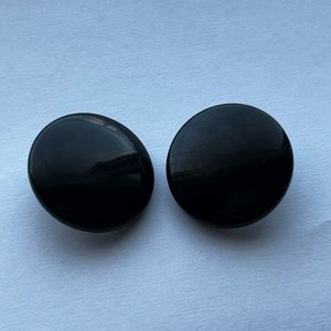 Plain black circular clip on earrings